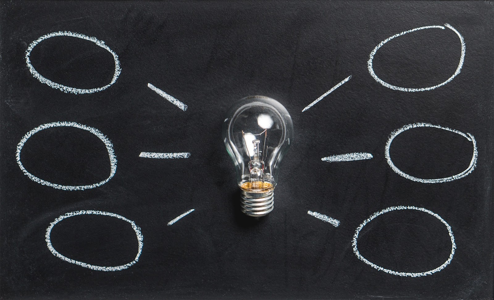 A light bulb surrounded by different ideas. There are a lot of ways you can learn how to speak a language.