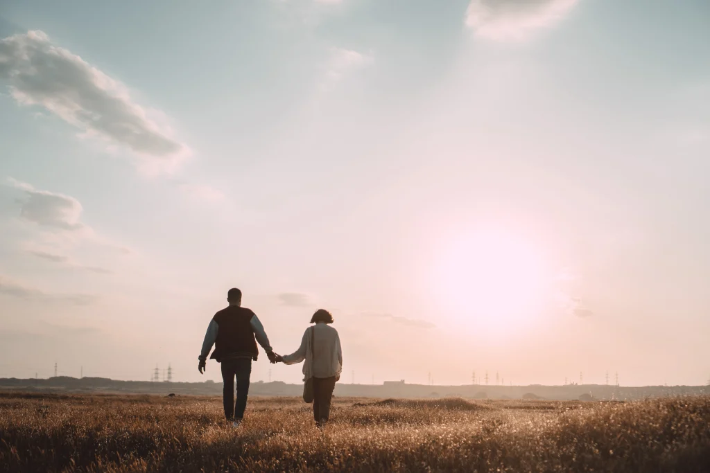 Two people holding hands