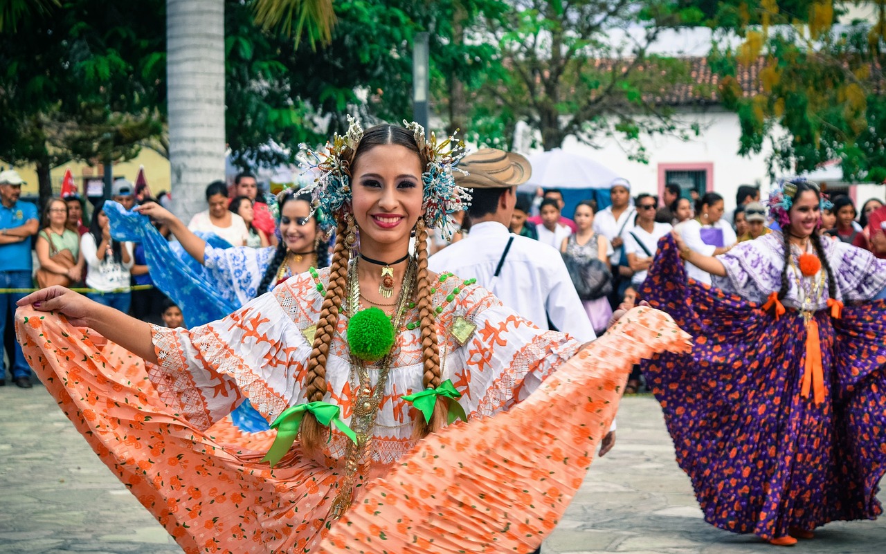 Two women dance in traditional clothing in Costa Rica