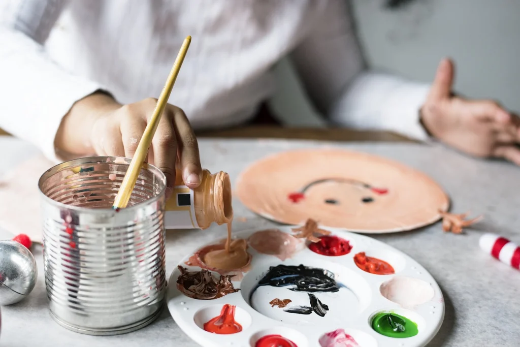 A picture of someone painting with acrylic paint.