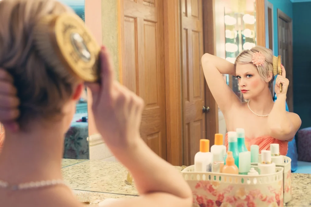 A woman in front of a mirror