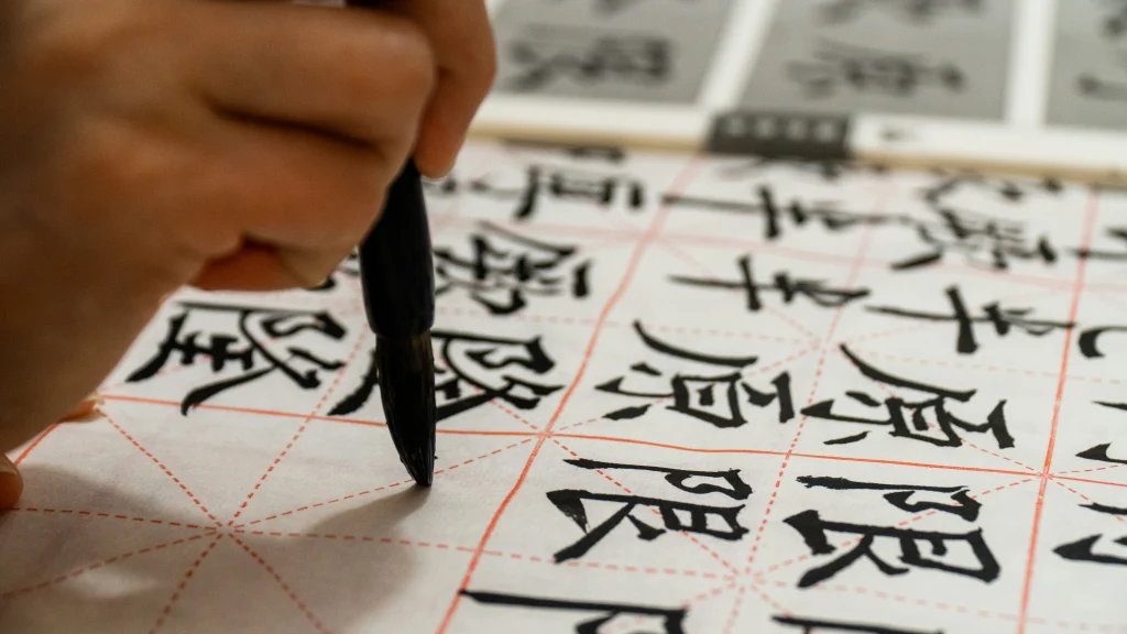A student practicing writing Chinese characters