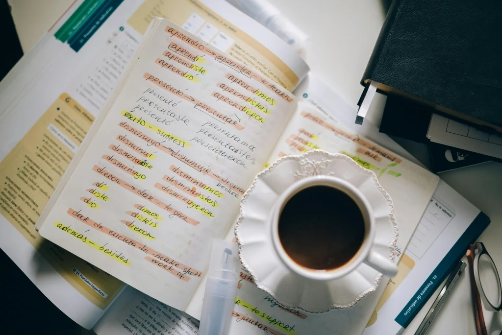 A notebook with Spanish verb conjugations